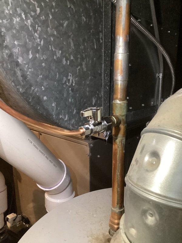 Successfully installed an evaporative humidifier system integrated with existing HVAC ductwork, including proper connection of copper water supply lines and electrical wiring. Manual humidistat was temporarily installed with note that replacement unit will be provided during follow-up service.