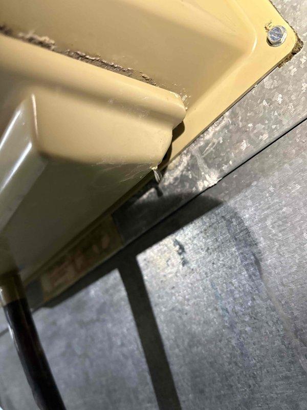 Responded to water leak concern near a 13-year-old Goodman furnace. Inspected system and identified deteriorated electrode/flame sensor with visible cracking, which was causing water intrusion during heavy rainfall. Replaced damaged component and secured proper mounting to prevent future leakage.