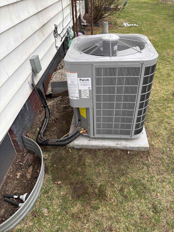 Successfully completed installation of new furnace and air conditioning system. Installed furnace unit with proper ductwork connections in utility area and mounted AC condenser unit on concrete pad with Puron Advance refrigerant lines connected to the home. All components professionally installed with appropriate electrical connections and verified operational.