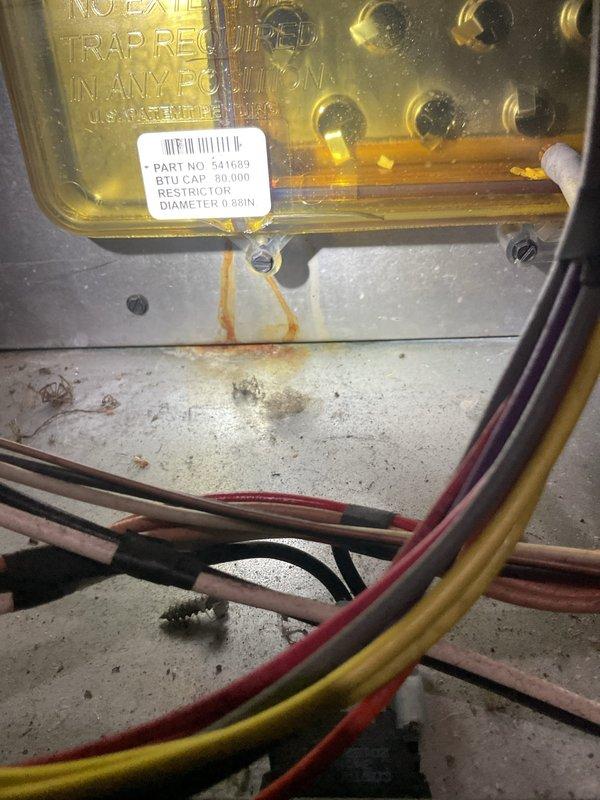 Diagnosed furnace failing to hold temperature with 8-12 degree variance below setpoint. Inspection of the 90,000 BTU system revealed illuminated diagnostic LEDs indicating system fault. Cleaned connections and verified proper operation of restrictor plate (0.68IN diameter), restoring normal temperature maintenance capability.