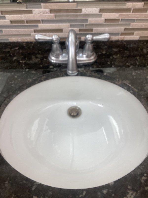 Successfully removed existing bathroom sink fixtures and installed client-supplied faucet assembly on granite vanity countertop. Completed all connections, tested for proper water flow and ensured no leaks at connection points.