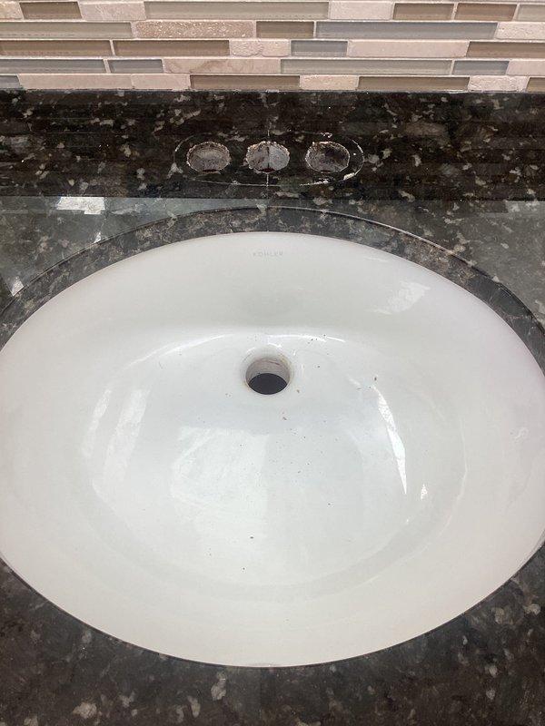 Successfully removed existing bathroom sink fixtures and installed client-supplied faucet assembly on granite vanity countertop. Completed all connections, tested for proper water flow and ensured no leaks at connection points.