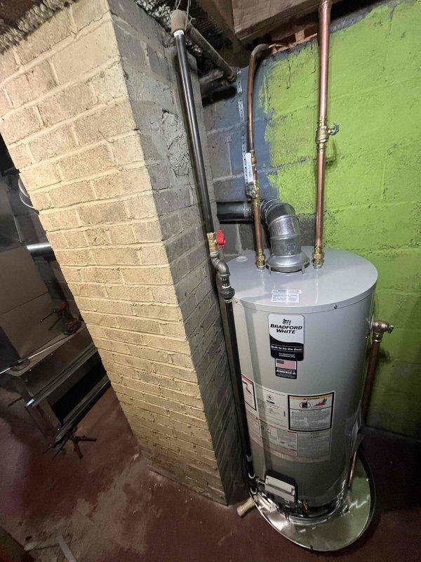 Completed installation of new Carrier furnace, Bradford White water heater, and AC system in customer's home. All units were properly connected to existing ductwork and plumbing, with appropriate ventilation and connections verified. Final inspection confirmed all systems are functioning correctly with proper safety measures in place.