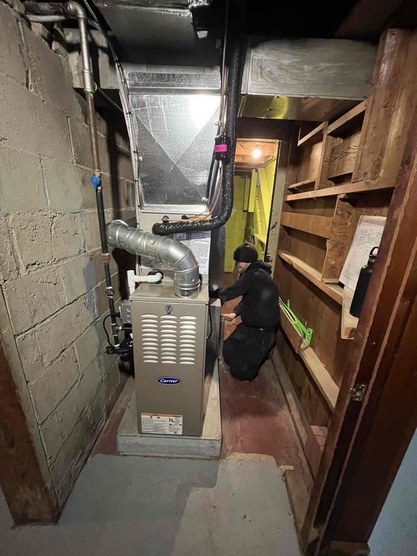 Completed installation of new Carrier furnace, Bradford White water heater, and AC system in customer's home. All units were properly connected to existing ductwork and plumbing, with appropriate ventilation and connections verified. Final inspection confirmed all systems are functioning correctly with proper safety measures in place.
