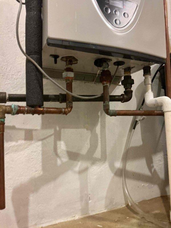 Diagnosed and repaired a 5-year-old Lochinvar tankless water heater that was producing noise during operation. Inspection revealed significant corrosion and oxidation at copper pipe connections, particularly at joints where slow leaks had developed. Cleaned corroded fittings, replaced damaged pipe sections, and resealed connections to eliminate noise and prevent further water damage.