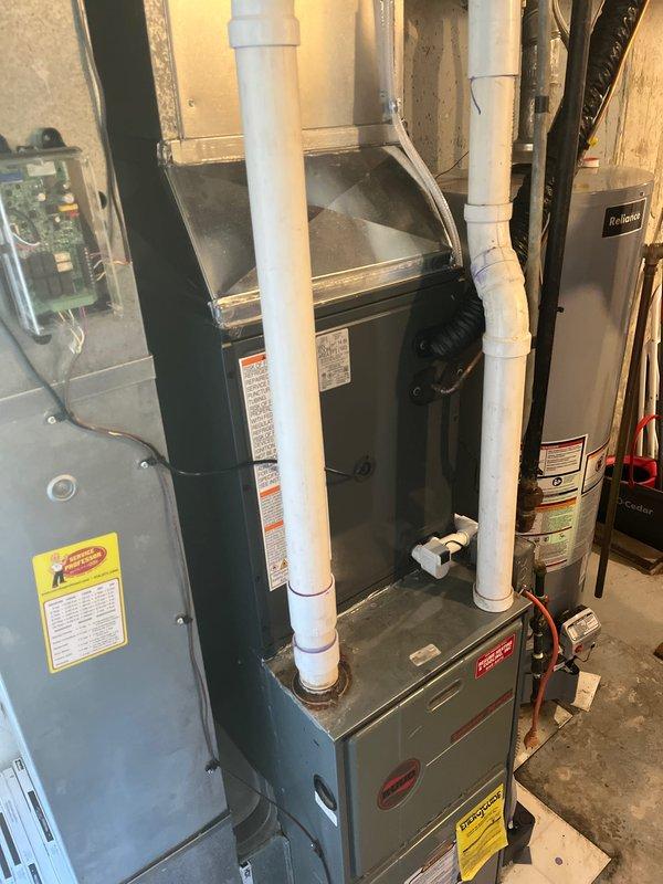 Successfully completed installation of a new air conditioning system, including proper connection of the outdoor condenser unit mounted on a concrete pad with appropriate refrigerant lines and electrical connections. System was fully tested and is functioning according to manufacturer specifications, with all components properly installed including PVC ventilation piping and control wiring.