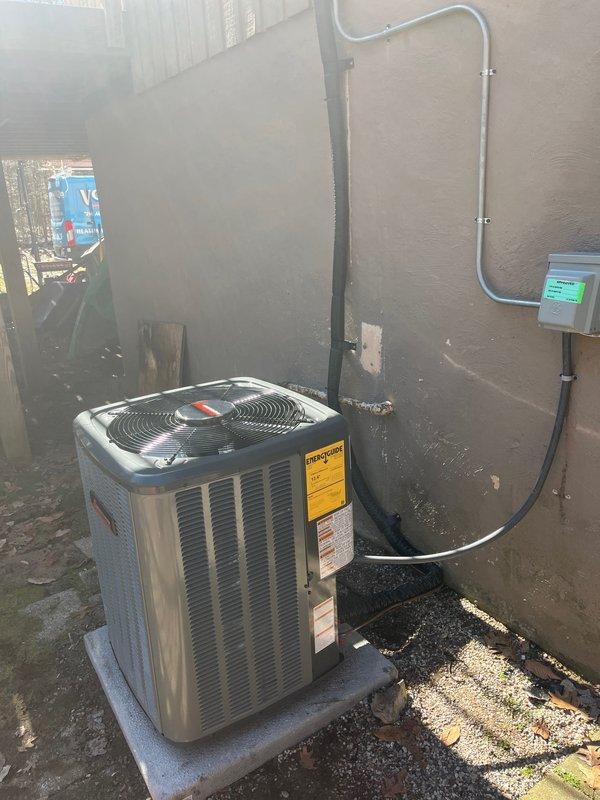 Successfully completed installation of a new air conditioning system, including proper connection of the outdoor condenser unit mounted on a concrete pad with appropriate refrigerant lines and electrical connections. System was fully tested and is functioning according to manufacturer specifications, with all components properly installed including PVC ventilation piping and control wiring.