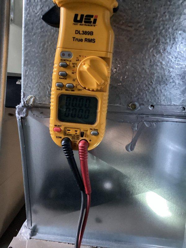 Responded to a service call for a 3-year-old Luxaire furnace that was not heating to temperature. Conducted electrical diagnostics using a UEi DL389B clamp meter to verify proper voltage and current readings at the unit. Customer had already replaced the furnace with another company's equipment prior to my arrival.