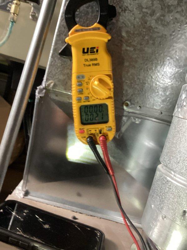 Responded to a service call for a 3-year-old Luxaire furnace that was not heating to temperature. Conducted electrical diagnostics using a UEi DL389B clamp meter to verify proper voltage and current readings at the unit. Customer had already replaced the furnace with another company's equipment prior to my arrival.