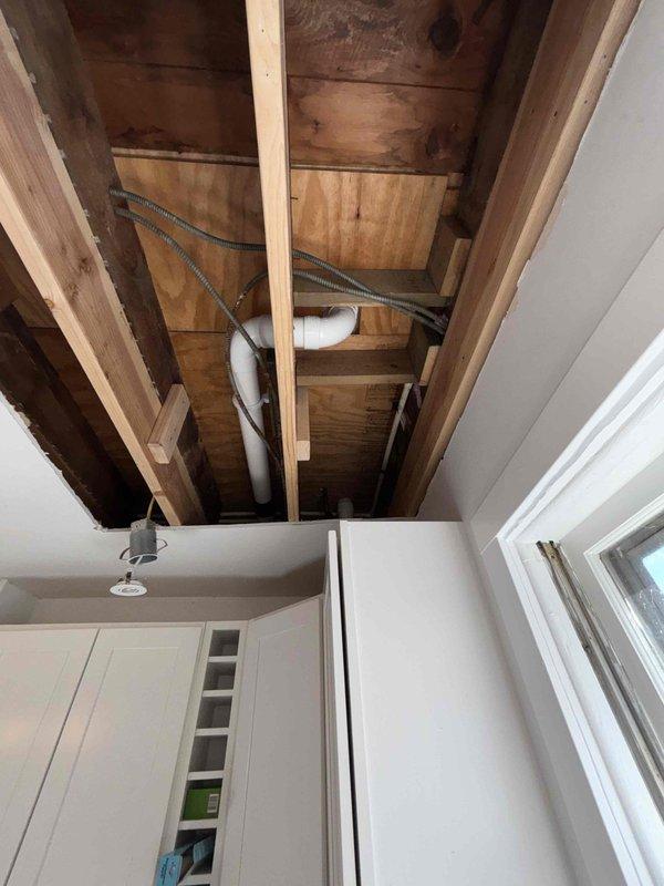 Successfully opened drywall to access and replace leaking section of 4" pipe in ceiling. Removed toilet on main floor bathroom to conduct camera inspection of the line, identifying and resolving the secondary cause of clogging.