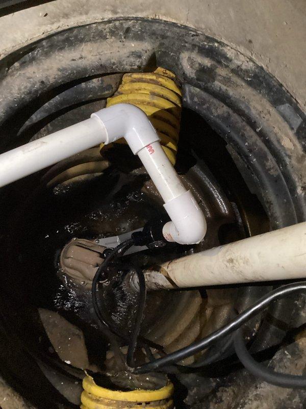 Completed sump pump replacement in basement drainage system. Existing unit was approximately 20 years old with significant sediment buildup in basin. Installed new sump pump with proper PVC discharge piping and verified proper operation of the system to ensure effective water management.