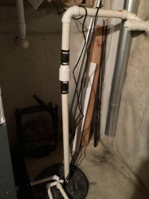 Completed sump pump replacement in basement drainage system. Existing unit was approximately 20 years old with significant sediment buildup in basin. Installed new sump pump with proper PVC discharge piping and verified proper operation of the system to ensure effective water management.