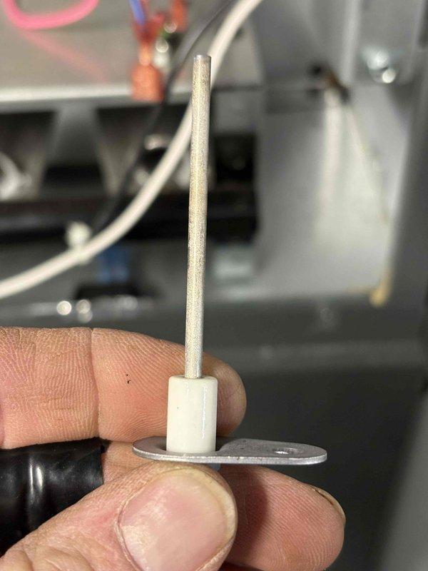Performed scheduled annual heating maintenance on 5-year-old Goodman furnace. Inspected and replaced flame sensor which showed signs of carbon buildup affecting system operation. Unit is now functioning properly with clean components and restored ignition reliability.