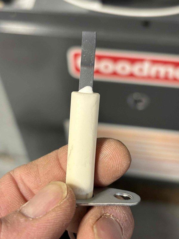 Performed scheduled annual heating maintenance on 5-year-old Goodman furnace. Inspected and replaced flame sensor which showed signs of carbon buildup affecting system operation. Unit is now functioning properly with clean components and restored ignition reliability.