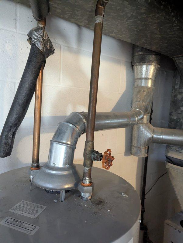 Diagnosed knocking noise in 4-year-old water heater (CM: 2025) by inspecting ductwork and plumbing connections. Determined noise was caused by thermal expansion in the metal vent pipe during heating cycles; confirmed normal operation with no leaks or functionality issues present.