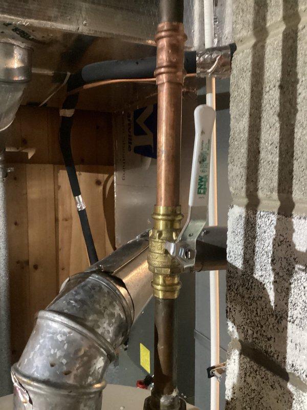 Responded to emergency call for failed water heater shut-off valve that had caused customer to shut off main water supply. Replaced defective brass valve fitting on copper supply line, resoldering connections and testing for proper operation. Restored full water service to residence and verified no leaks present in the new installation.