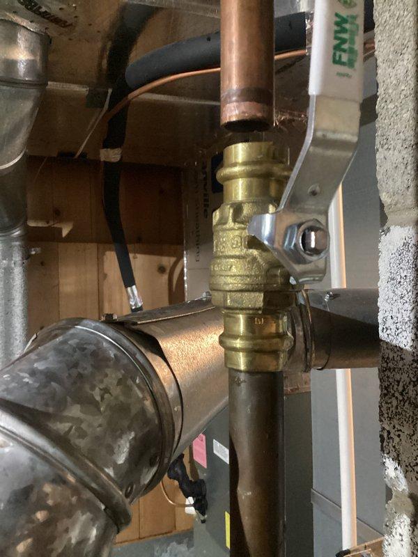 Responded to emergency call for failed water heater shut-off valve that had caused customer to shut off main water supply. Replaced defective brass valve fitting on copper supply line, resoldering connections and testing for proper operation. Restored full water service to residence and verified no leaks present in the new installation.