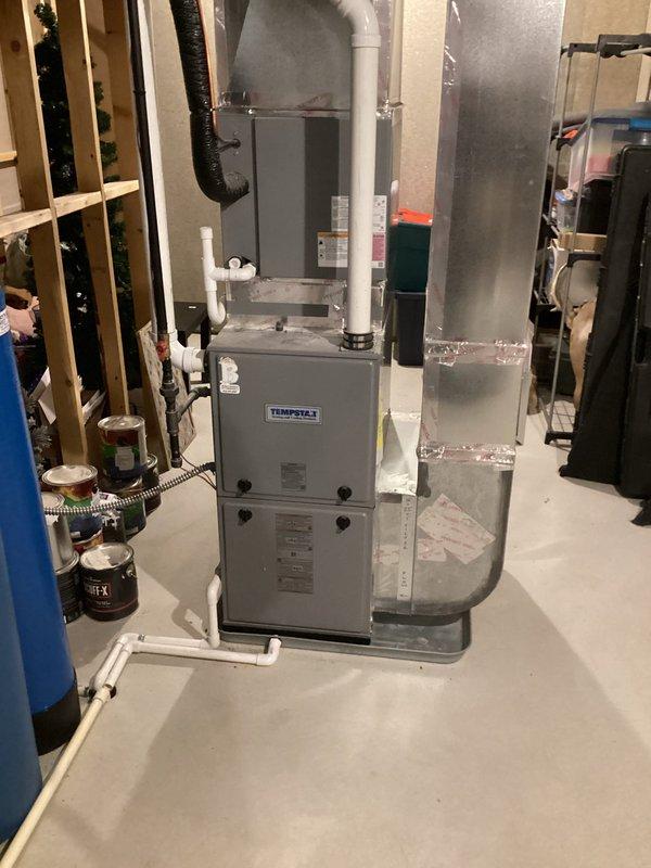 Diagnosed Defender water heater with flashing green light (4 blinks) indicating error code. Reset thermal switch to restore hot water functionality after verifying proper electrical connections and water supply. Recommended monitoring system performance as this is a recurring issue that previously occurred 3-4 weeks ago on this 3-year-old unit.