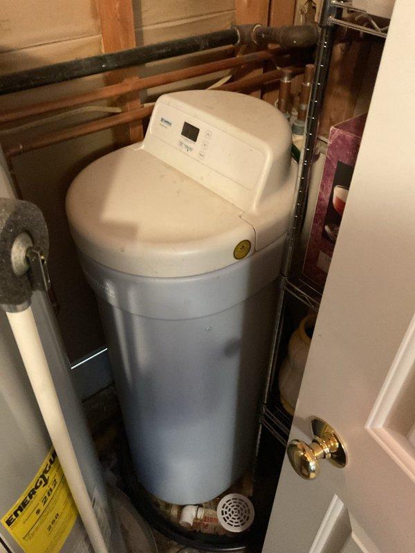 Successfully installed a water softener system in a 30-year-old home. Unit was properly connected to existing copper plumbing with appropriate drain line installation. System was tested and confirmed operational with control panel programmed to optimal settings based on household water conditions.