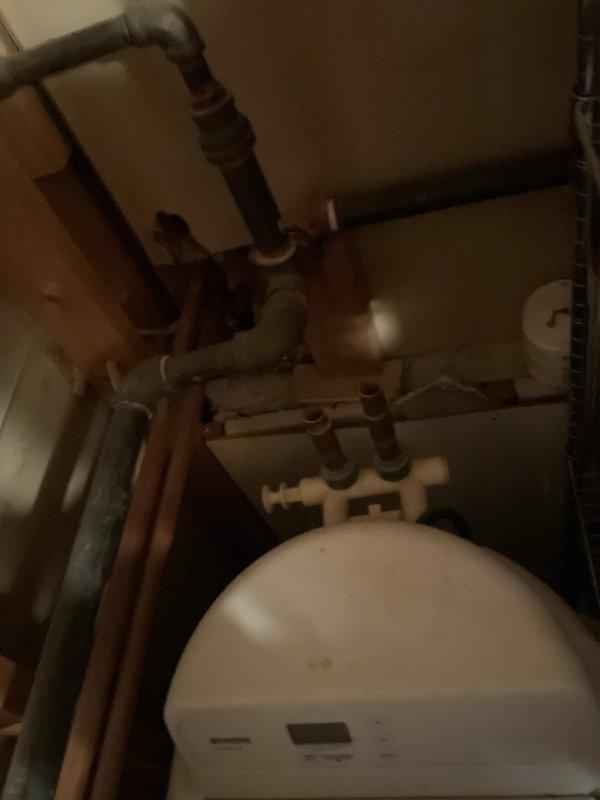 Successfully installed a water softener system in a 30-year-old home. Unit was properly connected to existing copper plumbing with appropriate drain line installation. System was tested and confirmed operational with control panel programmed to optimal settings based on household water conditions.