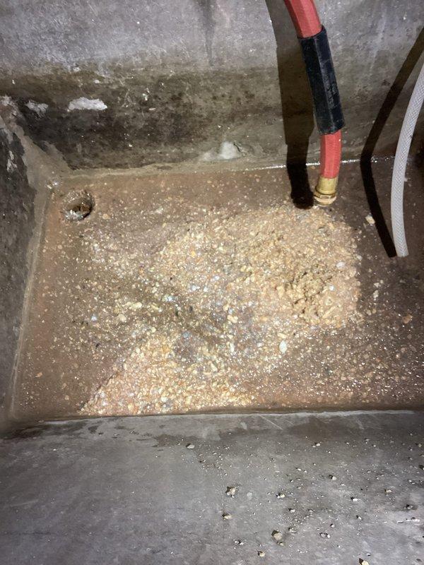 Successfully installed expansion tank on hot water system. Mounted new blue expansion tank vertically with proper copper pipe connections to existing water heater. Verified system operation and checked for leaks after installation.