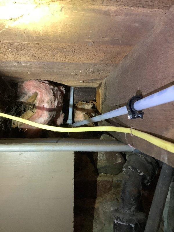 Completed quoted repair job involving replacement of upstairs kitchen water supply lines and PVC drain pipes in a residential property. Work included installation of new PVC drainage components and water supply lines, properly secured with metal brackets to floor joists in the basement/crawlspace area. All connections were tested to ensure proper function and absence of leaks.