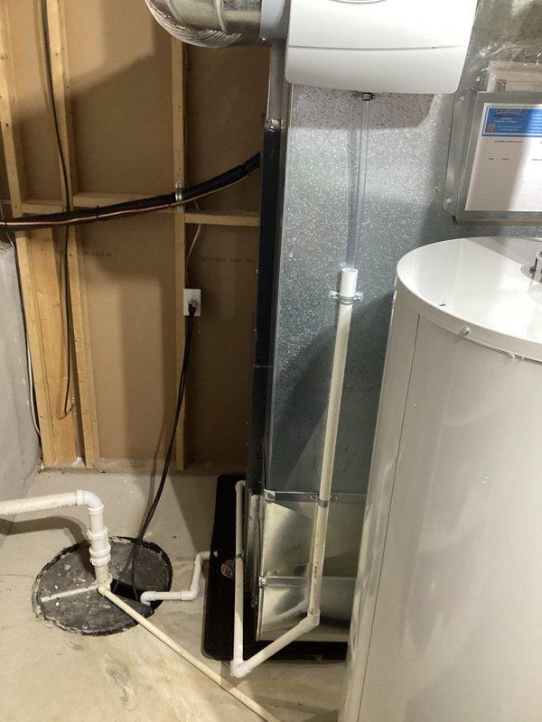 Successfully completed installation of new Amana furnace and AC system, including proper mounting of furnace on platform with connected PVC venting and drainage. System includes all necessary ductwork connections and was fully tested to ensure optimal performance.