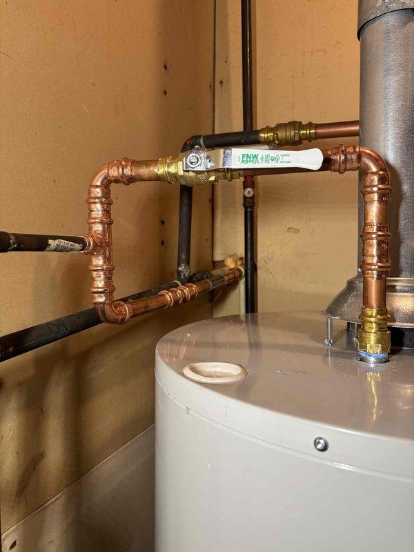 Completed QUOTR-Quoted Repair involving inspection of water heater installation with copper supply lines and FNW valve. Took documentation photos of the properly assembled piping configuration and connections. Will return to complete shut-off valve replacement as quoted per CWOW service requirements.