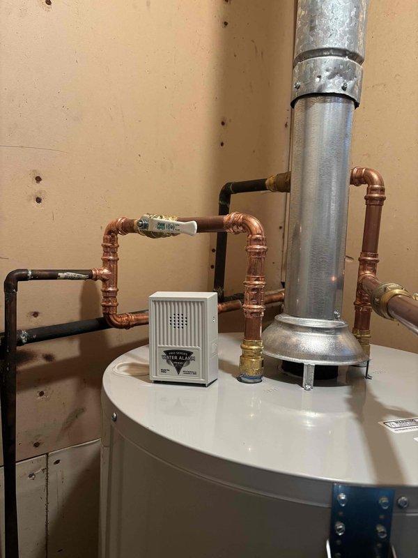 Completed QUOTR-Quoted Repair involving inspection of water heater installation with copper supply lines and FNW valve. Took documentation photos of the properly assembled piping configuration and connections. Will return to complete shut-off valve replacement as quoted per CWOW service requirements.