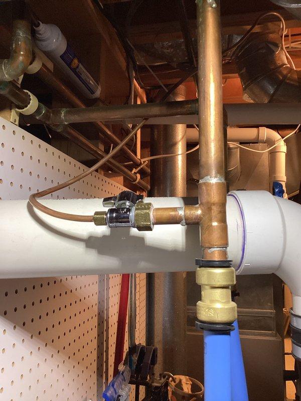 Performed annual heating maintenance on 13-year-old Carrier furnace. Inspected and cleaned AprilAire humidifier unit mounted on HVAC system. Checked water supply connections, including copper and PVC plumbing components, and verified proper operation of humidifier as part of service club maintenance.