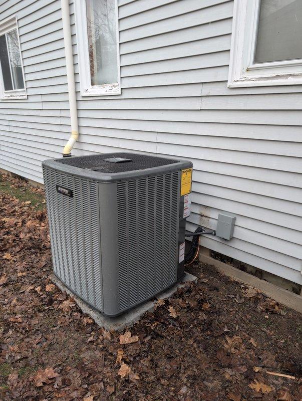Successfully installed a new air conditioning system with Michigan Saves financing. The installation included proper mounting of the outdoor condenser unit on a concrete pad with appropriate electrical connections and PVC line set. System was integrated with the existing furnace and ductwork in the utility room, with all components properly connected and operational.