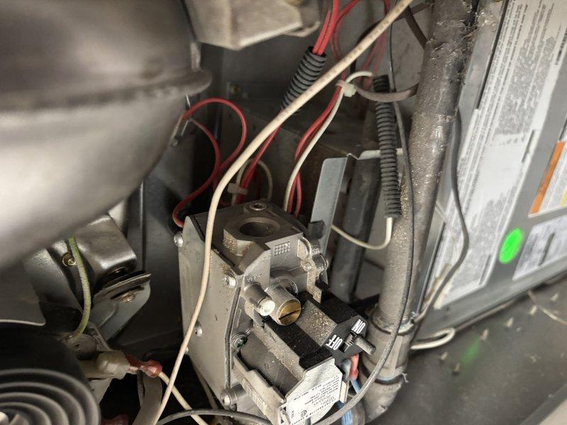 Completed annual heating service on 12-year-old ICP furnace. Inspected gas valve, control assembly, and electrical connections for proper operation. System shows normal operational wear but remains in functional condition with no immediate concerns identified.