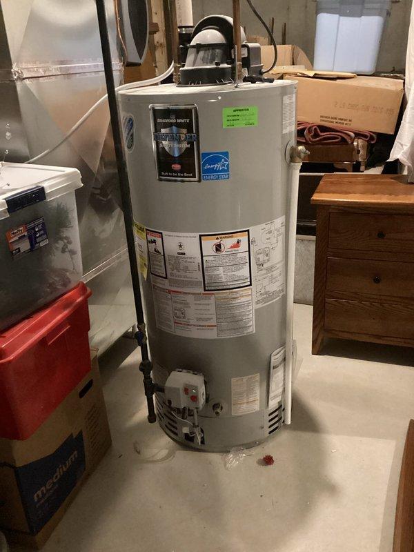 Diagnosed water heater showing no operational issues upon inspection; reset tripped breaker in electrical junction box which restored power to the unit. Verified proper function with hot water production resuming normally after power restoration.