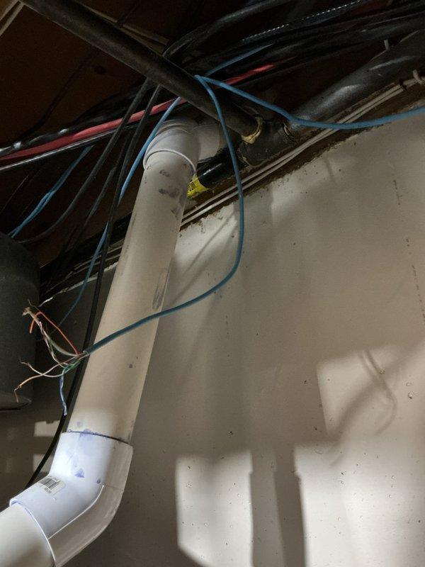 Responded to no-heat call and identified vapor/smoke discharge from ceiling vent system. Inspection revealed improper PVC pipe elbow connection in the ventilation system causing exhaust gases to escape into the living space. Repaired the disconnected vent pipe and secured all joints to restore proper exhaust flow, resolving the heating safety issue.