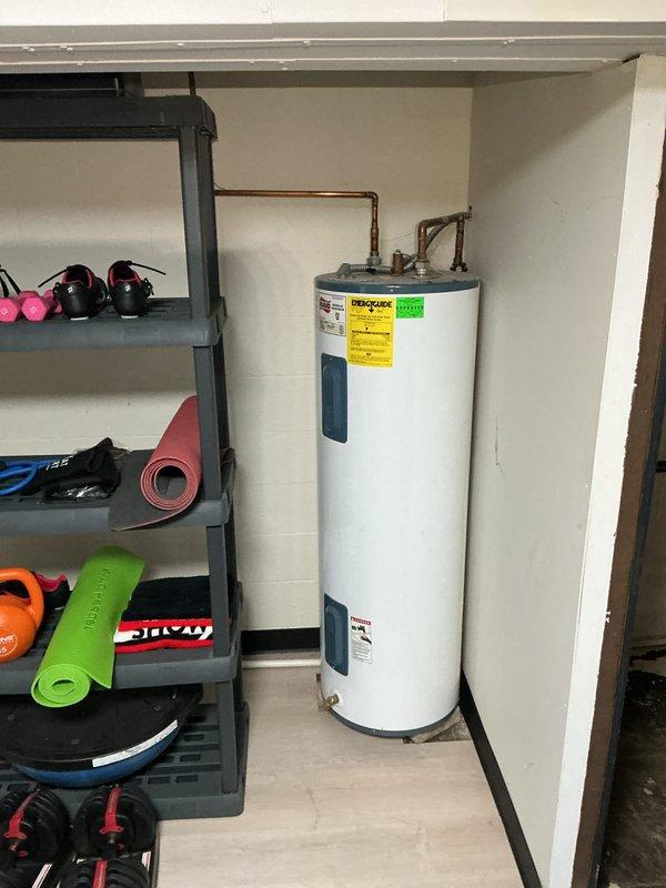 Conducted water heater assessment in basement utility area for customer reporting unit failure. Inspected existing unit, which appears to be a standard tank-style water heater with copper supply lines, and documented current installation conditions. Photos taken of the installation environment to assist with proper replacement sizing and installation requirements.