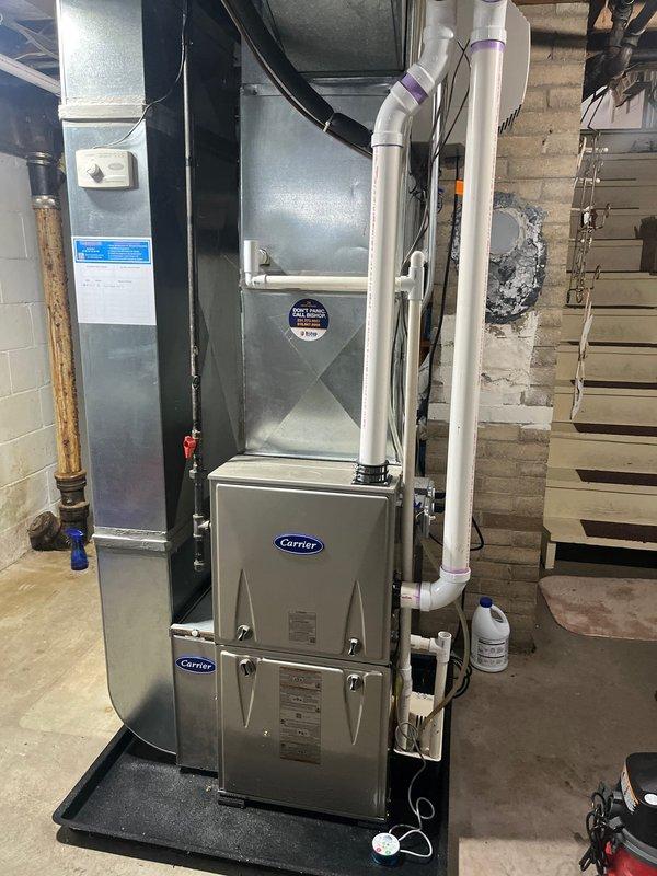 Responded to no heat call for a 2-year-old Carrier furnace. Inspection revealed a failed pressure switch due to moisture accumulation in the condensate line. Cleared the blockage, verified proper drainage, and confirmed system operation with multiple heating cycles.