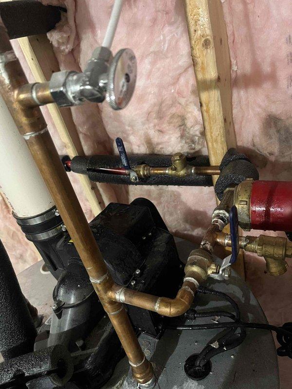 Diagnosed water heater system with no hot water production and leaking. Replaced failed Grundfos circulation pump and associated brass fittings. Performed pressure test after installation to confirm proper operation and verify leak resolution.