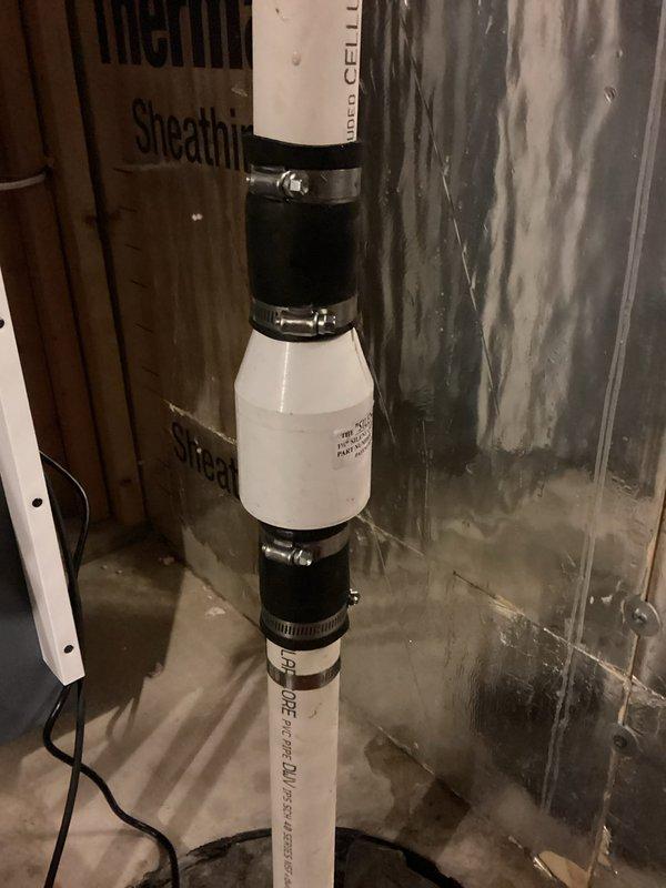 Responded to sump pump failure issue; found significant corrosion and wear on existing pump components. Installed new vertical PVC discharge pipe system with rubber couplings and metal hose clamps, ensuring proper connection to drainage system. Completed installation and verified proper pump operation before leaving premises.