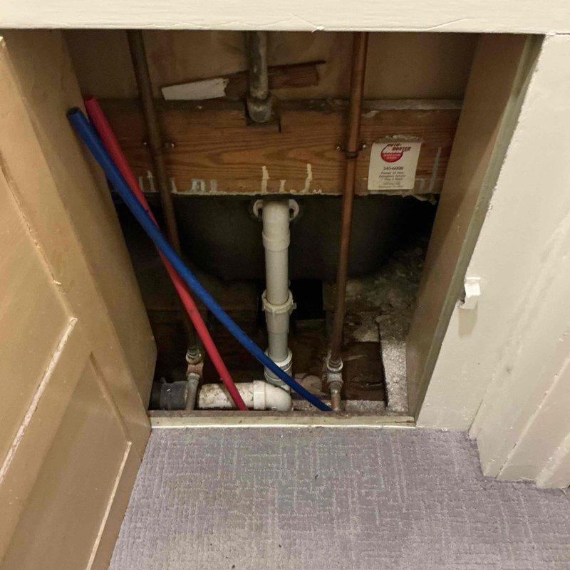 Responded to a call for a leaking galvanized T-fitting in utility room. Discovered significant water damage and mold on walls surrounding the utility sink. Inspected PEX and copper supply lines in wall access panel. Provided client with information on water softener options as requested.