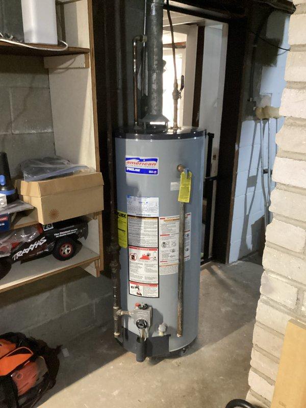 Performed scheduled water heater tune-up on a 20-year-old American brand unit. Inspected all connections, checked venting system functionality, and verified proper operation of temperature and pressure relief valve. Unit shows normal signs of aging on copper piping and fittings but remains in functional condition with no immediate safety concerns identified.
