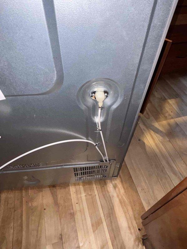 Responded to service call for ice maker malfunction following previous plumbing work. Inspected refrigerator water supply line and connection valve, finding the blue inlet valve had not been properly opened after the earlier service. Restored water flow to the ice maker by correctly positioning the valve and verified proper operation before completing the service.