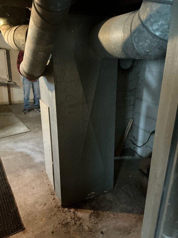 Conducted furnace estimate for 16-year-old non-operational heating system located in basement utility room. Unit showed significant age-related wear with visible dust and discoloration on ductwork. Recommended replacement due to age and condition of equipment.