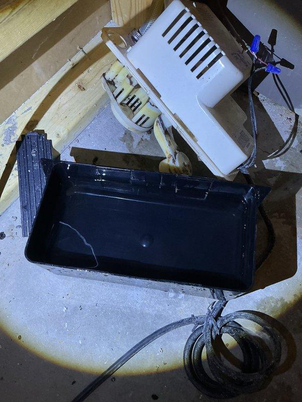 Performed annual heating tune-up on 16-year-old York furnace with attached humidifier. Identified significant buildup and debris in the condensate drain pan, with visible staining and corrosion at connection points. Cleaned drainage system components and verified proper operation of the condensate pump.