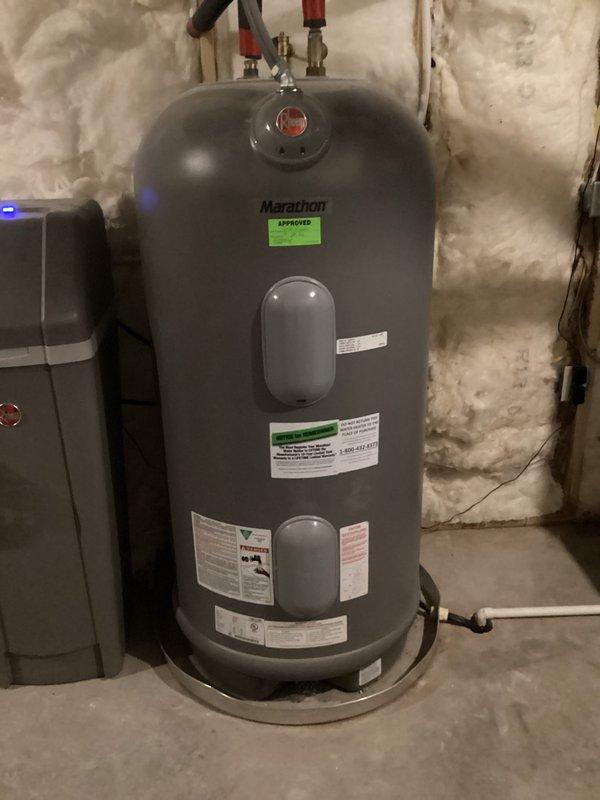 Performed annual tune-up on 3-year-old Trane furnace system as part of complimentary maintenance service. Inspected water heater and existing HVAC equipment in basement mechanical room. Discussed customer's interest in natural gas conversion options for furnace, stove, and fireplace.