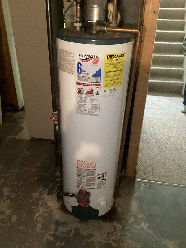 Responded to emergency call for leaking Richmond water heater approximately 5 years old. Inspection revealed significant corrosion at dissimilar metal connection points between copper piping and galvanized steel components. Replaced deteriorated dielectric unions, installed new pressure relief valve, and performed comprehensive system test to verify proper operation and absence of leaks.
