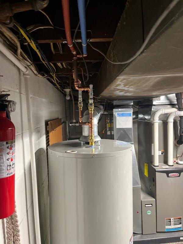Successfully completed installation of a 40-gallon natural gas water heater with short draw. Installation included proper connection of copper supply lines, installation of code-compliant ventilation system, and verification of all shut-off valves and fittings for optimal operation and safety.