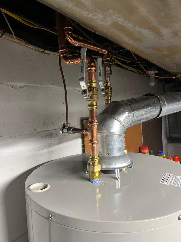 Successfully completed installation of a 40-gallon natural gas water heater with short draw. Installation included proper connection of copper supply lines, installation of code-compliant ventilation system, and verification of all shut-off valves and fittings for optimal operation and safety.