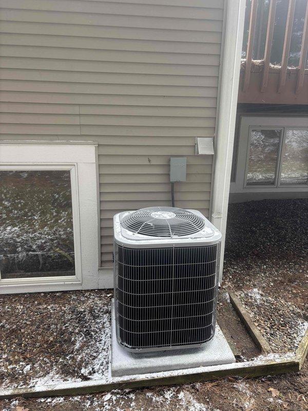 Successfully completed installation of a new residential HVAC system, including an outdoor air conditioning condensing unit mounted on a concrete pad with proper electrical connections and a high-efficiency furnace in the utility room with all required ductwork connections. System was fully tested and verified operational with all components properly secured and installed according to manufacturer specifications.