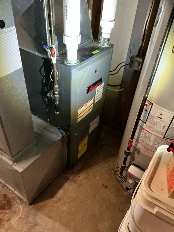 Inspected 10+ year old furnace in response to reported noise from condensate pump and no heat condition. Visual examination of the HVAC system revealed proper installation with PVC ventilation pipes and connected ductwork. Identified and addressed the malfunctioning condensate pump causing the noise issue and restored proper heating function to the system.