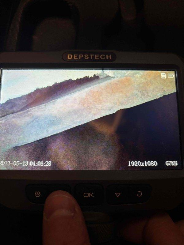 Inspected 5-year-old GE water heater showing significant corrosion and rust staining from top connections down the tank. Used borescope camera to examine internal components and identified deterioration requiring attention. Completed necessary repairs to address leakage issues while maintaining unit's heating functionality.